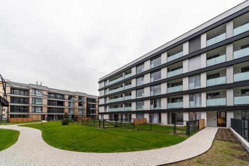 an external view of a building with a grass courtyard at Residence Mozaika in Prague