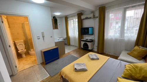 a living room with a couch and a table in it at Voždovac Vitanovacka in Belgrade