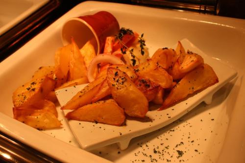 a white plate of food with a plate of food at Langham Place Guangzhou - Walking distance to Canton Fair in Guangzhou