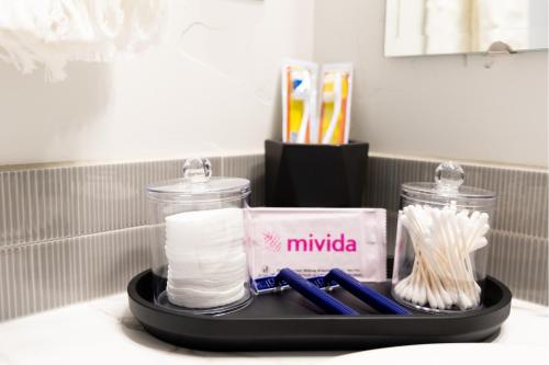 a tray with toilet paper and toothbrushes on a counter at Play Relax Ping Pong, Foosball, Arcades, Park in Meridian