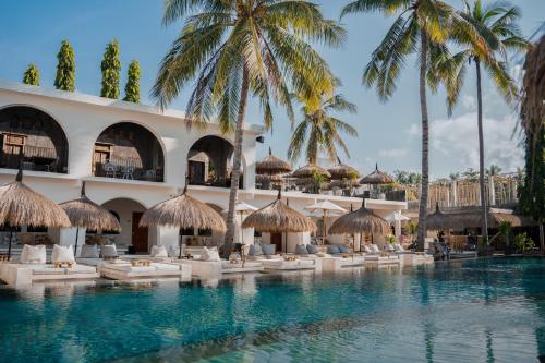 a pool at the resort at El Tropico Boutique Hotel in Kuta Lombok