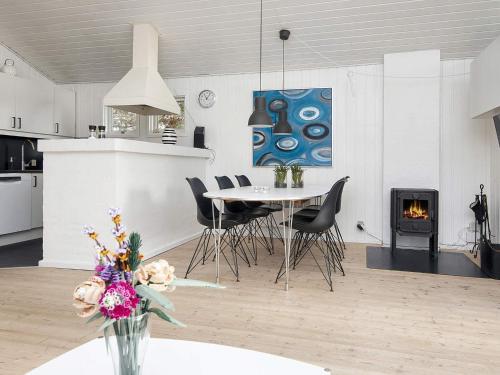 a kitchen and dining room with a table and chairs at 4 star holiday home in Juelsminde-By Traum in Sønderby
