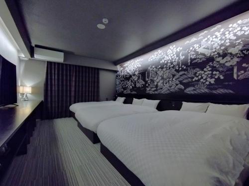 Postel nebo postele na pokoji v ubytování a-un（Luxury Hotel）