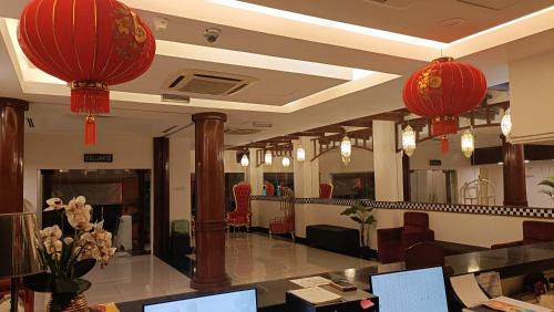 a lobby with red lanterns hanging from the ceiling at hotel bintang in Kuala Lumpur