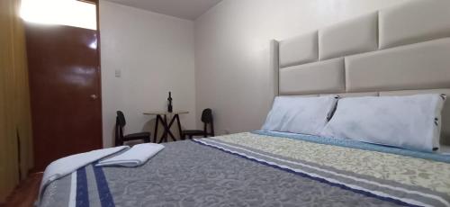 Postel nebo postele na pokoji v ubytování Hotel Melange Chincha
