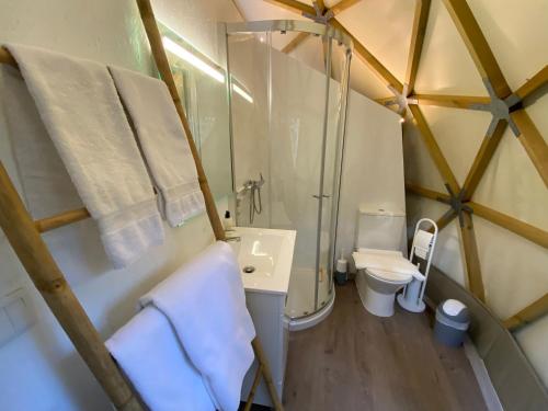 a bathroom with a sink and a toilet in a yurt at Dome - Colares, near the center of Sintra in Colares