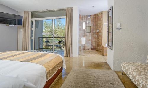 Ένα ή περισσότερα κρεβάτια σε δωμάτιο στο Francolin Lodge