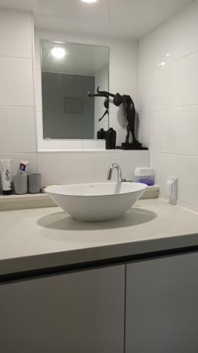 a bathroom counter with a sink and a mirror at Haeundae Mipo House1 블루라인파크와LCT워터파크앞 바다도보2분 in Busan