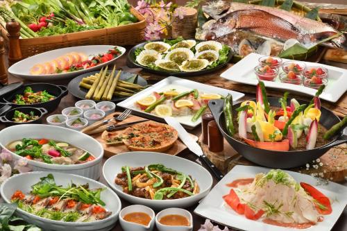 a table topped with lots of different types of food at Hachimantai Mountain Hotel & Spa in Hachimantai