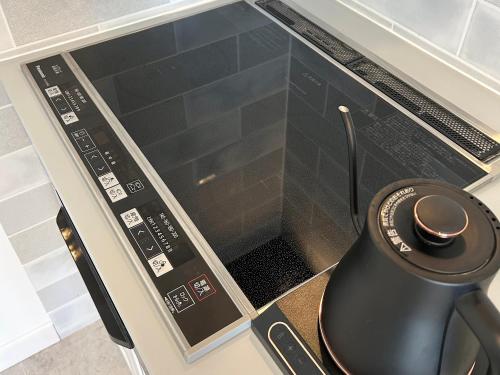 a microwave oven with a window on top of it at HAKONE DOMA in Hakone