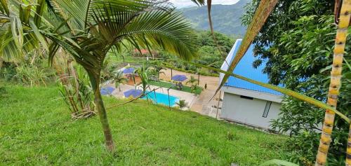 a view of a house with a swimming pool at TERRA LOMA House Hotel in Nimaima