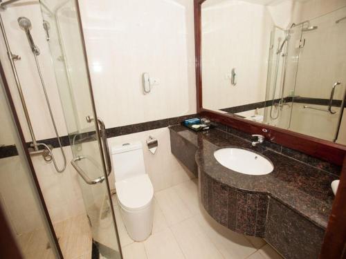 a bathroom with a toilet and a sink and a shower at Sao Mai Hotel - 23 Tôn Đức Thắng - by Bay Luxury in Hanoi