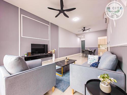 a living room with a couch and a tv at Skudai Paradigm Mall by RR JBcity in Johor Bahru