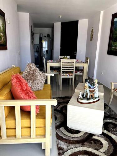 a living room with a couch and a table at Acogedor apartamento en San Gil. in San Gil