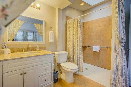 a bathroom with a toilet and a sink and a shower at 5BR Monument Charm Walk to Shops & Wedding Venue in Monument