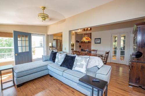 a living room with a couch and a table at Sunset Cottage #3 in Hamilton