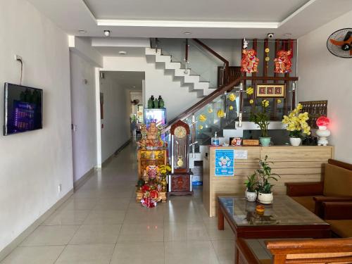 a hallway with a staircase and a room at DANA BEACH Motel in Da Nang