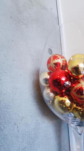a glass bowl filled with different colored glass ornaments at Karuizawa Tennku Hotel & Resort in Karuizawa