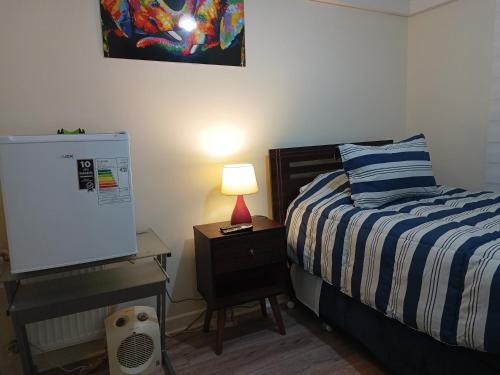 Postel nebo postele na pokoji v ubytování Hermosa habitación en exclusivo barrio de Talca