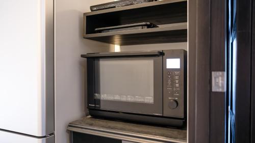 今津にあるうさぎ屋のカウンターの上に置かれた電子レンジ