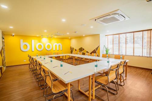 a large conference room with a long table and chairs at Bloom Hotel - Medicity Gurugram, Near Medanta Hospital in Gurgaon
