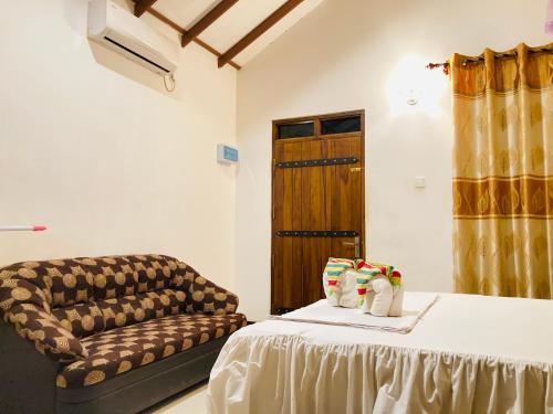 Postel nebo postele na pokoji v ubytování suncity privacy cottages
