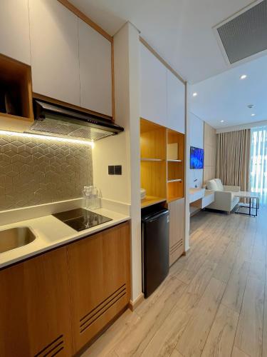 a kitchen with a sink and a counter top at Luna Apartment - Apec Mandala Phú Yên in Tuy Hoa
