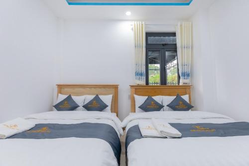 Postel nebo postele na pokoji v ubytování Palm 14 DaLat - In Nam Ho Resort