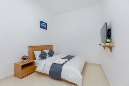 Postel nebo postele na pokoji v ubytování Palm 14 DaLat - In Nam Ho Resort