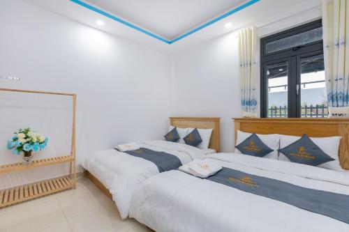 Postel nebo postele na pokoji v ubytování Palm 14 DaLat - In Nam Ho Resort