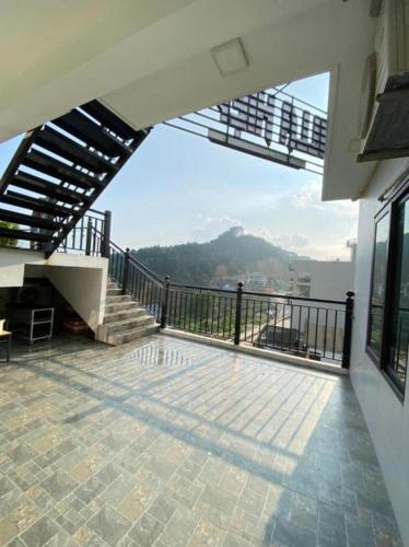 a balcony of a house with a view at Hiệp Gà Villa Tam Đảo - Venuestay in Tam Ðảo
