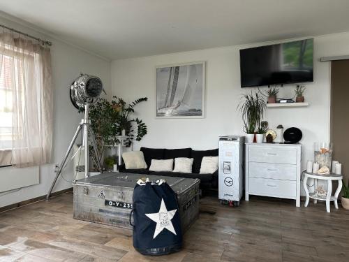 Televízia a/alebo spoločenská miestnosť v ubytovaní Vista Suites 1-2