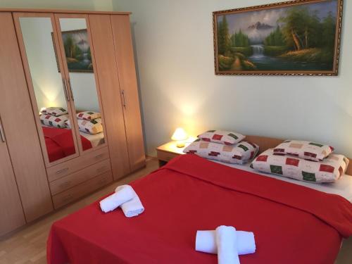 Posteľ alebo postele v izbe v ubytovaní Green Park Apartment