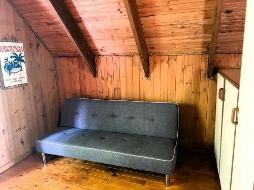 a room with a bench in the corner of a house at Muri Vista Villas in Rarotonga