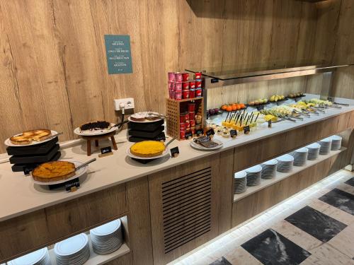 a buffet line with many different types of food at Turia Valencia in Valencia