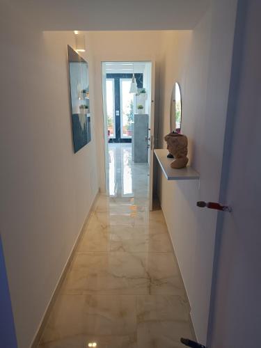 a hallway of a house with a tile floor at Blumoon boutique in Andria