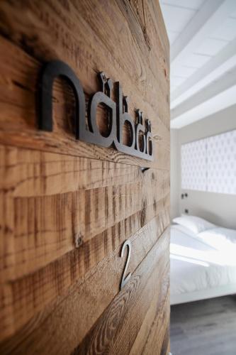 Ένα ή περισσότερα κρεβάτια σε δωμάτιο στο Naboo Verona Luxury Suites
