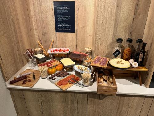 a table with many different types of food on it at Turia Valencia in Valencia