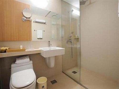 a bathroom with a toilet and a sink and a shower at Hotel Travel in Incheon
