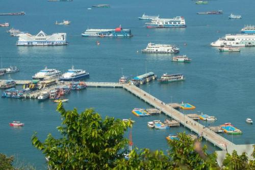 a harbor filled with lots of boats in the water at P.72 Hotel in Pattaya South