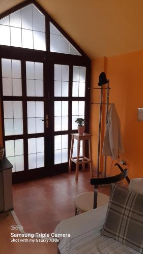 a room with a large glass door in a room at Fly in Dobanovci