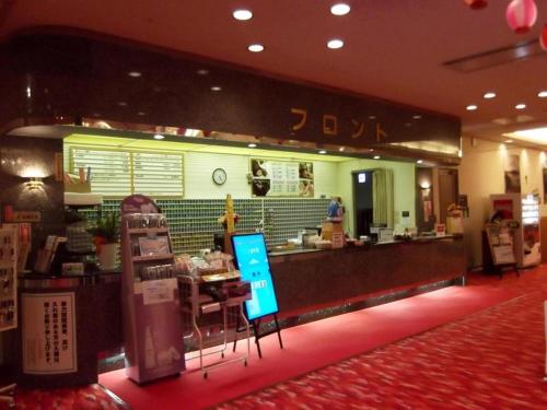 a fast food restaurant with a counter in front of it at Hokkaido Futomi Meisen Manyo no Yu in Sapporo