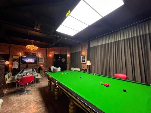a billiard room with a pool table in it at Letana Hotel Samuprakarn in Bang Phli