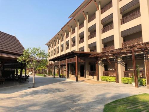 a large building with a street in front of it at Pawa Place (By Inpawa) in Khon Kaen