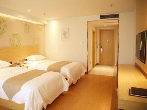 Ένα ή περισσότερα κρεβάτια σε δωμάτιο στο GreenTree Inn Heze Danxian Shangmaocheng Business Branch