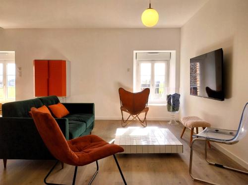 Ruang duduk di Appartement cosy chic La Ville au Monnier