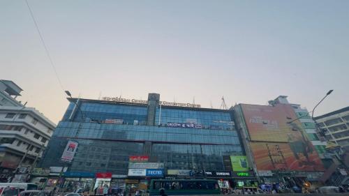 a large building in the middle of a city at Hotel Blue Sky Mirpur in Dhaka