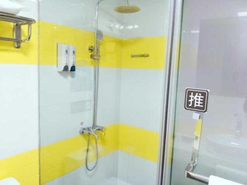 a shower with a glass door in a bathroom at 7 Days Premium Zunyi Renhuai Municipal Government in Renhuai