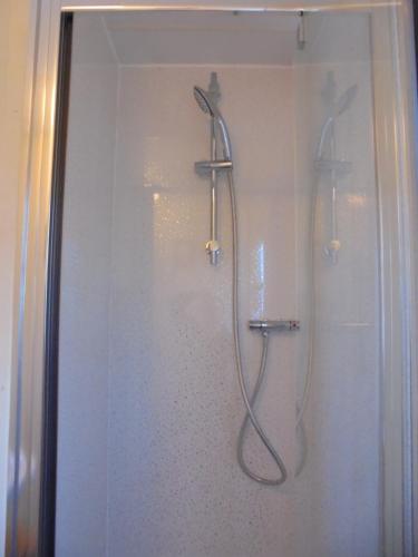 a shower with a shower head in a bathroom at 6 berth 3 bedroom Northshore Skegness Emirates in Skegness