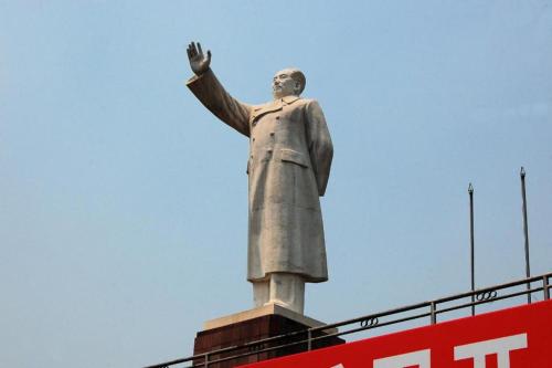 a statue of a man with his hand in the air at James Joyce Coffetel·Chengdu Chunxi in Chengdu